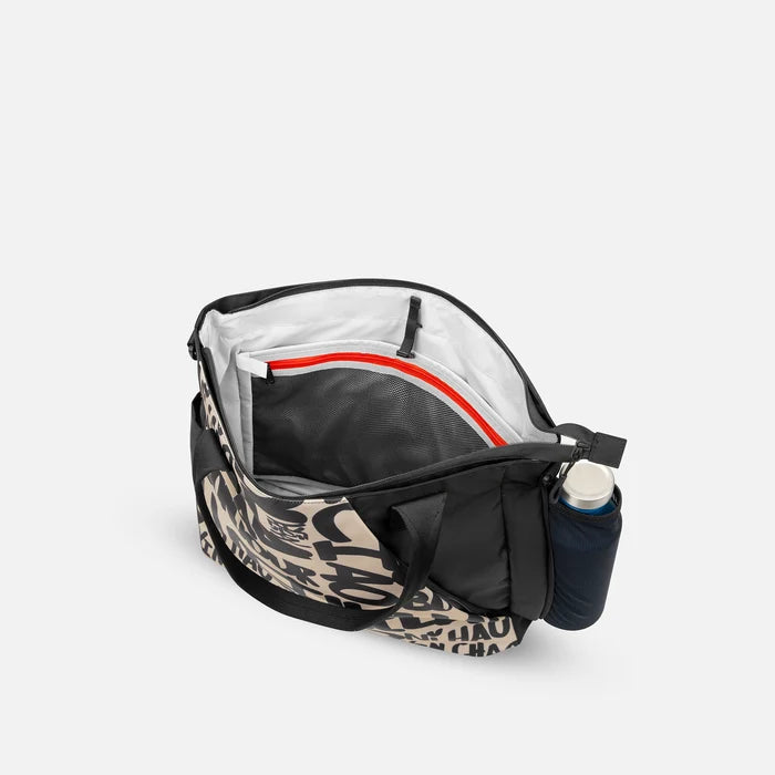 A Sherpani Jetsetter Ciao Travel Tote Bag, above view showing inside pockets on white backdrop.  #color_ciao-print