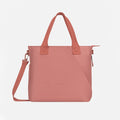 A Sherpani Jetsetter Desert Pink Travel Tote Bag, front view showing two strap options on white backdrop.  #color_desert-pink