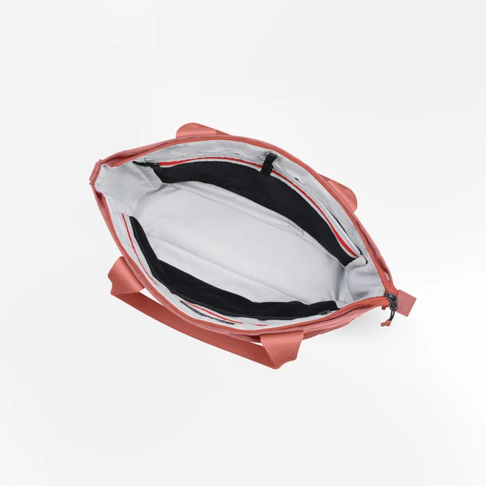 A Sherpani Jetsetter Desert Pink Travel Tote Bag, above view showing inside pockets on white backdrop.  #color_desert-pink