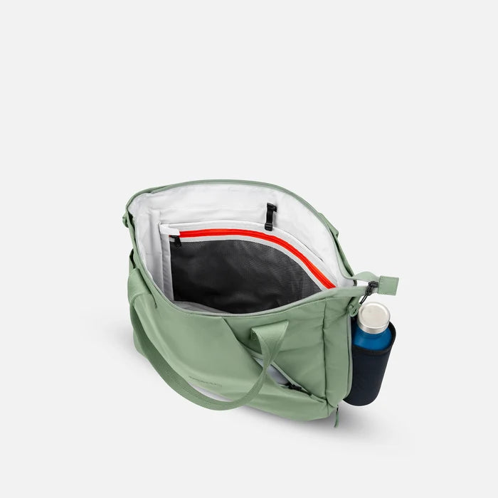 A Sherpani Jetsetter Olivine Travel Tote Bag, above view showing inside pockets on white backdrop. #color_olivine-green