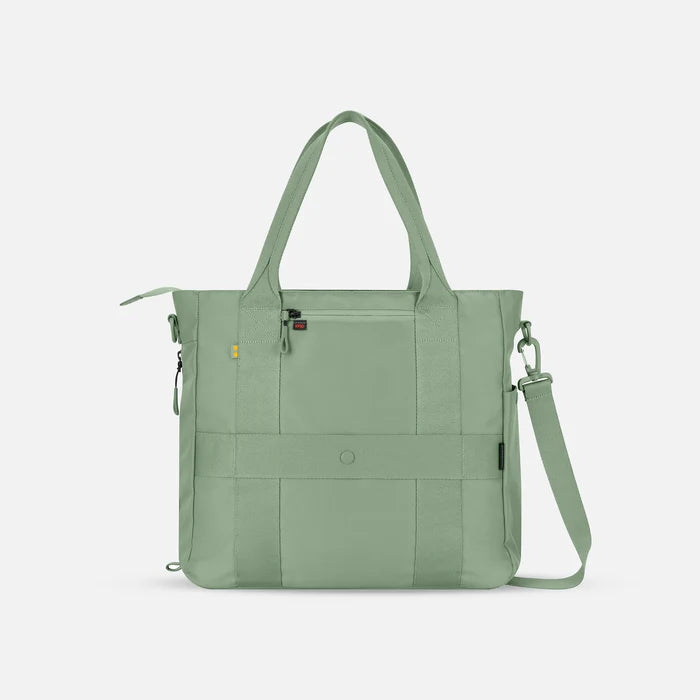 A Sherpani Jetsetter Olivine Travel Tote Bag, back view showing luggage strap and RFID pocket on white backdrop.  #color_olivine-green