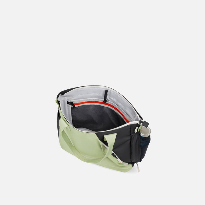 A Sherpani Jetsetter Palm Green Travel Tote Bag, above view showing inside pockets on white backdrop. #color_palm-green