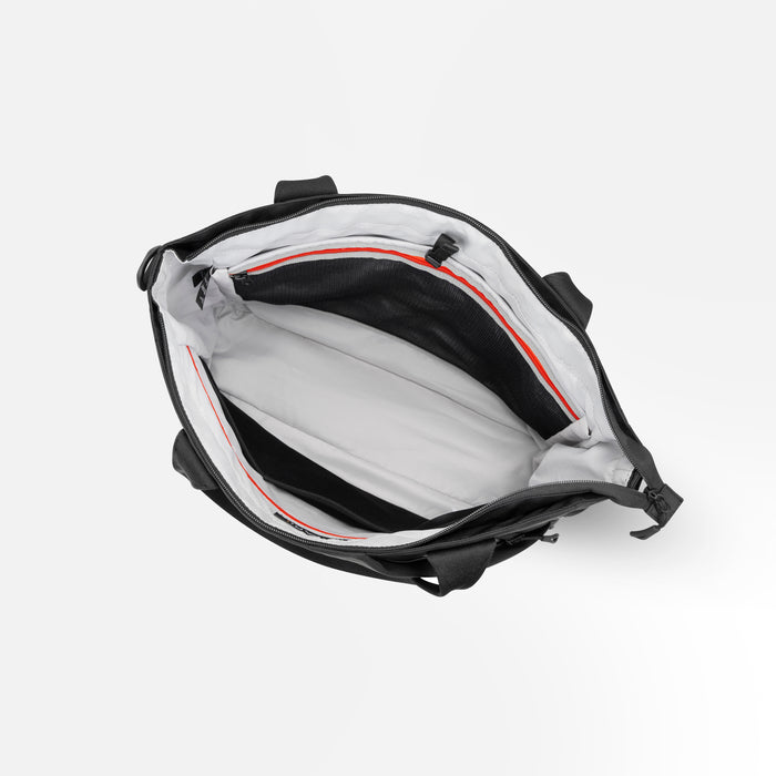 A Sherpani Jetsetter Raven Black Travel Tote Bag, above view showing inside pockets on white backdrop. #color_raven-black