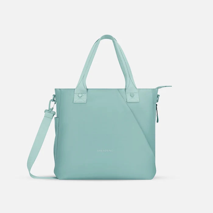 A Sherpani Jetsetter Surf Blue Travel Tote Bag, front view showing two strap options on white backdrop. #color_surf-blue