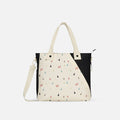 A Sherpani Jetsetter Terrazzo Print Travel Tote Bag, front view showing two strap options on white backdrop. #color_terrazzo-print