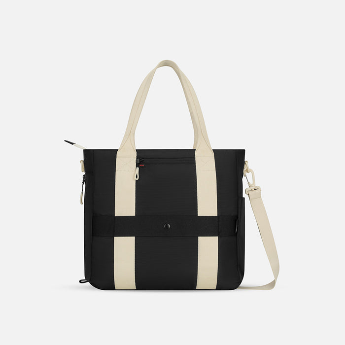 A Sherpani Jetsetter Terrazzo Print Travel Tote Bag, back view showing luggage strap and RFID pocket on white backdrop.  #color_terrazzo-print