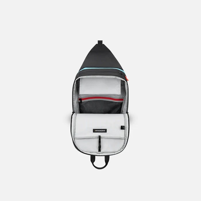A Sherpani Juno Chromatic Black Duffel Backpack, above view showing inside main pocket on white backdrop.   #color_chromatic-black