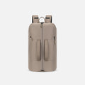 A Sherpani Juno Dune Duffel Backpack, front view showing duffle straps and main pocket on white backdrop. #color_dune-tan