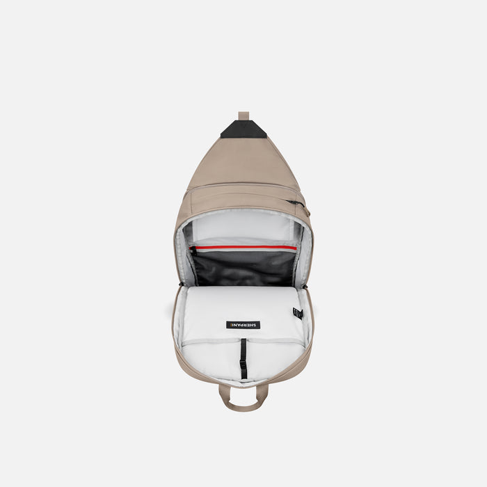 A Sherpani Juno Dune Duffel Backpack, above view showing inside main pocket on white backdrop.   #color_dune-tan