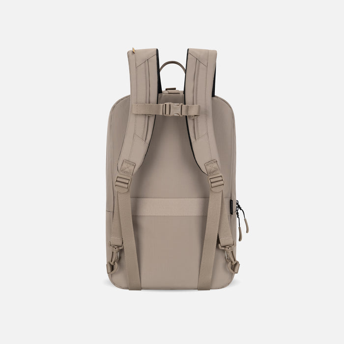 A Sherpani Juno Dune Duffel Backpack, back view showing shoulder straps with buckle on white backdrop.   #color_dune-tan