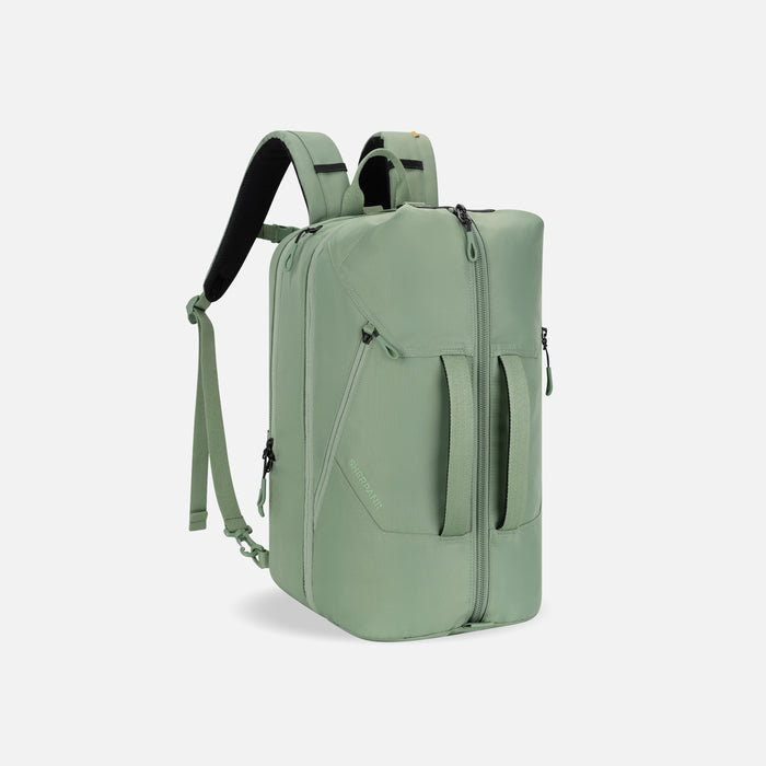 A Sherpani Juno Olivine Duffel Backpack, 3/4 view showing duffle straps and main pocket on white backdrop.   #color_olivine-green