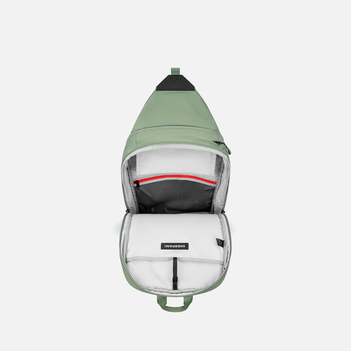 A Sherpani Juno Olivine Duffel Backpack, above view showing inside main pocket on white backdrop.   #color_olivine-green