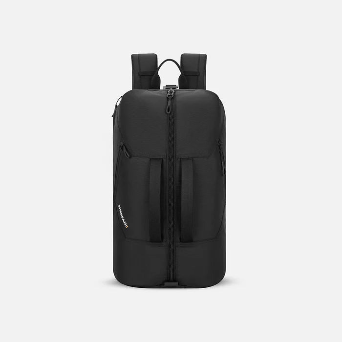 A Sherpani Juno Raven Black Duffel Backpack, front view showing duffle straps and main pocket on white backdrop. #color_raven-black