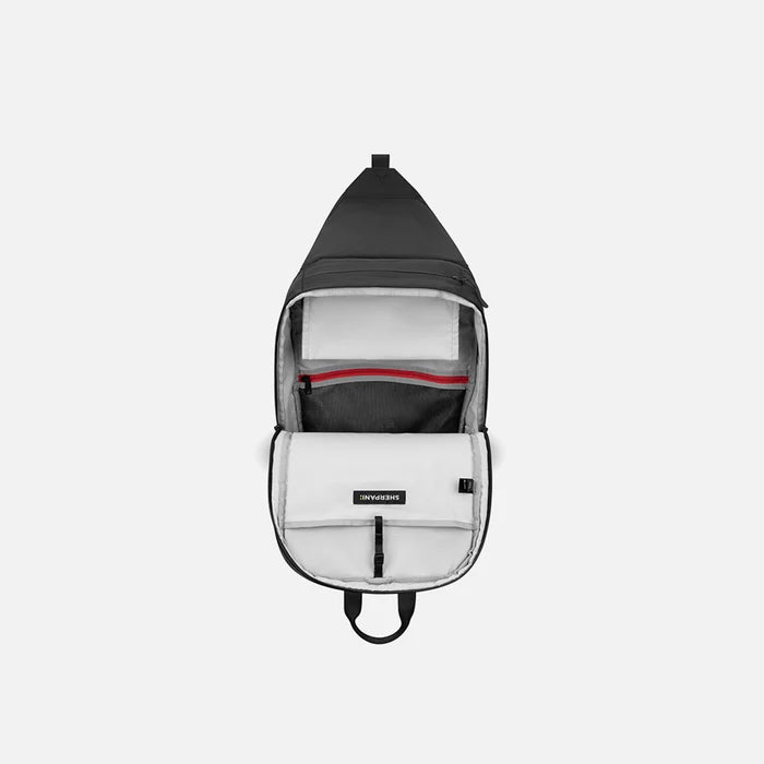A Sherpani Juno Raven Black Duffel Backpack, above view showing inside main pocket on white backdrop.   #color_raven-black