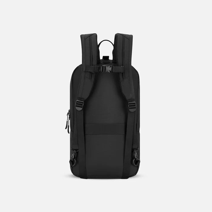 A Sherpani Juno Raven Black Duffel Backpack, back view showing shoulder straps with buckle on white backdrop. #color_raven-black