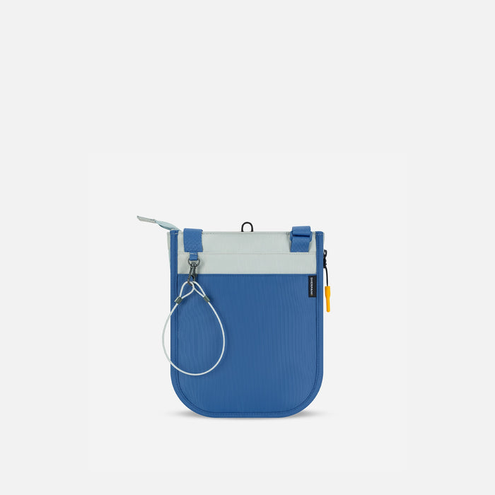 A Sherpani Lima Seastone Crossbody Purse, back view showing the chair lock on white backdrop.  #color_seastone