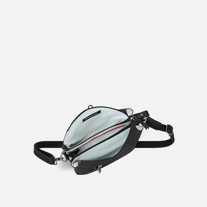 A Sherpani Mei Carbon Black Anti-theft Travel Trio Crossbody, above view showing inside three main pockets white backdrop.  #color_carbon-black