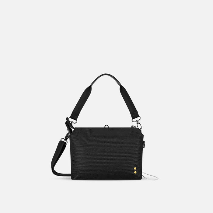 A Sherpani Mei Carbon Black Anti-theft Travel Trio Crossbody, back view showing strap options on white backdrop.  #color_carbon-black