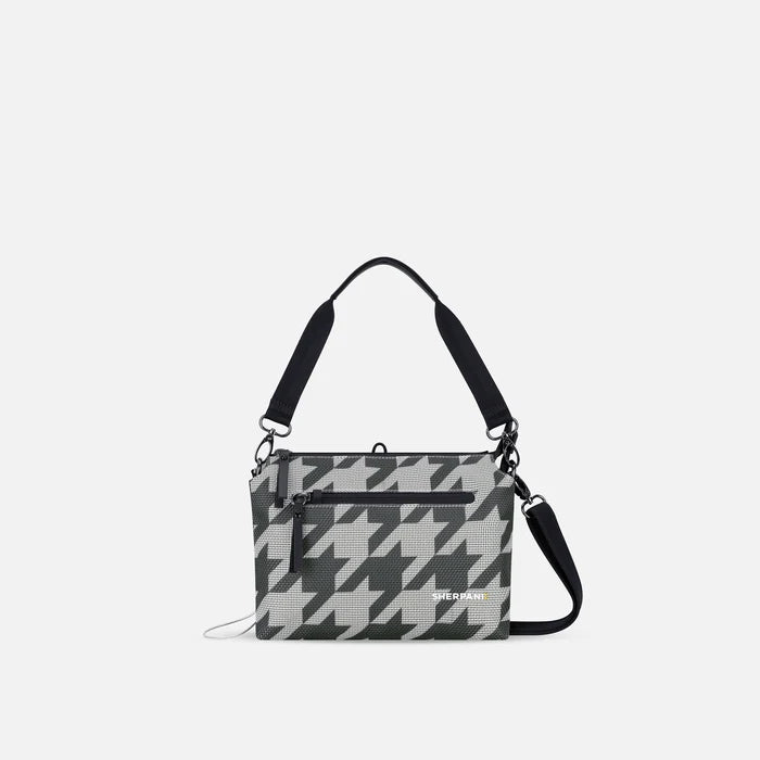 A Sherpani Mei Houndstooth Anti-theft Travel Trio Crossbody, front view showing lockable pockets on white backdrop.   #color_houndstooth-print
