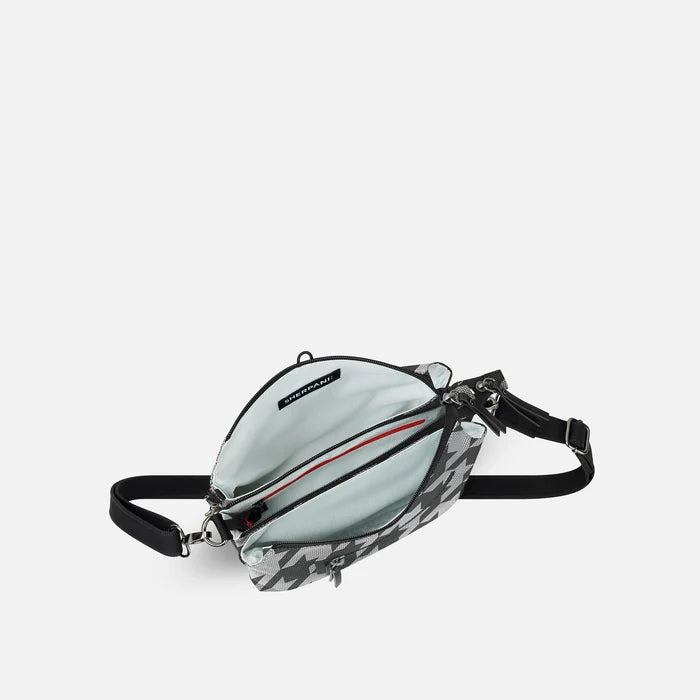 A Sherpani Mei Houndstooth Anti-theft Travel Trio Crossbody, above view showing inside three main pockets white backdrop.  #color_houndstooth-print