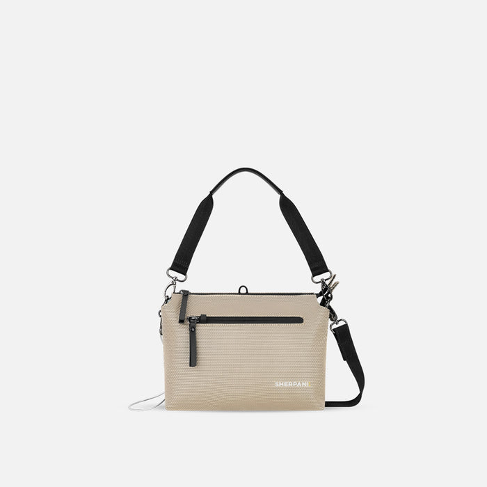A Sherpani Mei Straw Beige Anti-theft Travel Trio Crossbody, front view showing lockable pockets on white backdrop.  #color_straw-beige