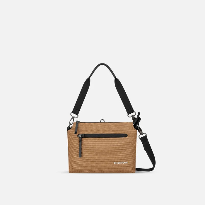 A Sherpani Mei Sand Anti-theft Travel Trio Crossbody, front view showing lockable pockets on white backdrop.   #color_sand-tan