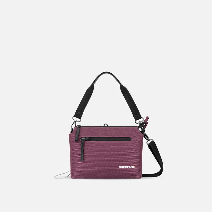 A Sherpani Mei Smoky Orchid Anti-theft Travel Trio Crossbody, front view showing lockable pockets on white backdrop.   #color_smoky-orchid-pink