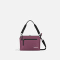 A Sherpani Mei Smoky Orchid Anti-theft Travel Trio Crossbody, front view showing lockable pockets on white backdrop.   #color_smoky-orchid-pink