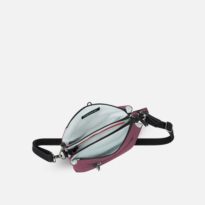 A Sherpani Mei Smoky Orchid Anti-theft Travel Trio Crossbody, above view showing inside three main pockets white backdrop.  #color_smoky-orchid-pink