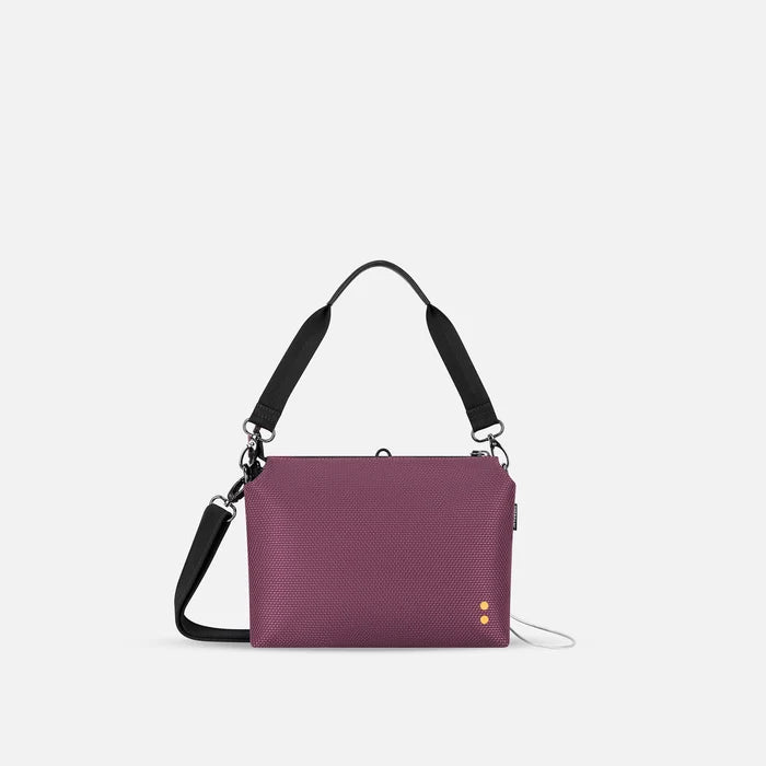 A Sherpani Mei Smoky Orchid Anti-theft Travel Trio Crossbody, back view showing strap options on white backdrop.  #color_smoky-orchid-pink