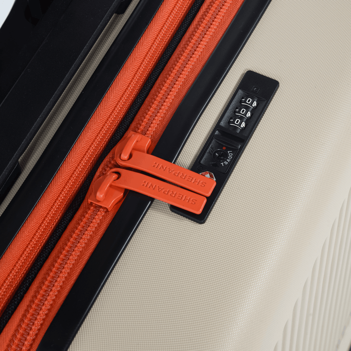 Close up of a Sherpani Meridian Chai Beige Carry-On Luggage, showing zipper code lock. #color_chai-beige