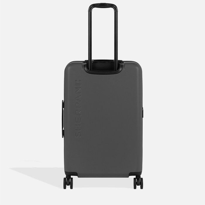 A Sherpani Meridian Granite Checked-Luggage, back view showing handle and Sherpani logo on white backdrop.   #color_granite-grey
