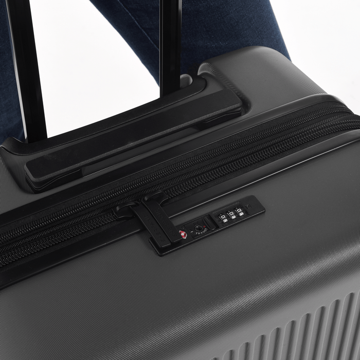 Close up of zipper code lock on a Sherpani Meridian Black Checked-Luggage. #color_granite-grey