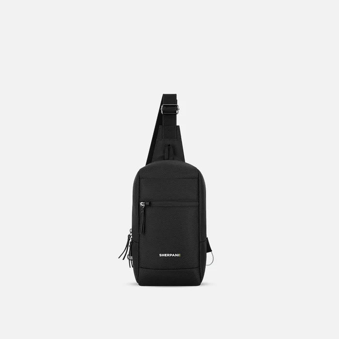 A Sherpani Metro Carbon Black Anti-theft Reversible Sling, front view showing lockable pocket and main strap on white background. #color_carbon-black