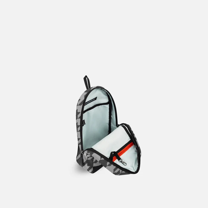 A Sherpani Metro Houndstooth Anti-theft Reversible Sling, 3/4 view open showing inside pocket against white background. #color_houndstooth-print
