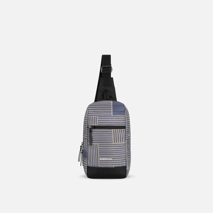 A Sherpani Metro Passport Anti-theft Reversible Sling, front view showing lockable pocket and main strap on white background. #color_passport-print