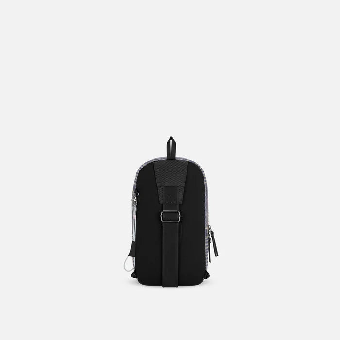 A Sherpani Metro Passport Anti-theft Reversible Sling, back view showing adjustable strap and chair lock on white background. #color_passport-print