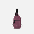 A Sherpani Metro Smoky Orchid Anti-theft Reversible Sling, front view showing lockable pocket and main strap on white background. #color_smoky-orchid-pink