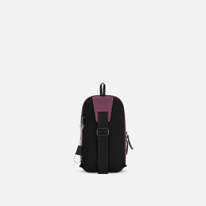 A Sherpani Metro Smoky Orchid Anti-theft Reversible Sling, back view showing adjustable strap and chair lock on white background. #color_smoky-orchid-pink