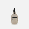 A Sherpani Metro Straw Beige Anti-theft Reversible Sling, front view showing strap & lockable pocket on white background. #color_straw-beige