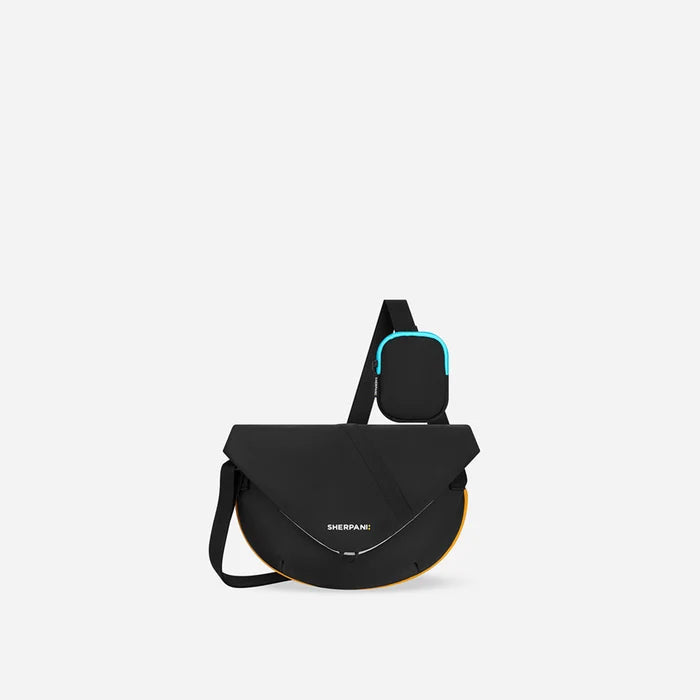 A Sherpani Milli Chromatic Black Mini Messenger, front view showing lockable front zipper pocket against white background.  #color_chromatic-black