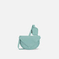 A Sherpani Milli Surf Blue Mini Messenger, front view showing lockable front zipper pocket against white background.  #color_surf-blue