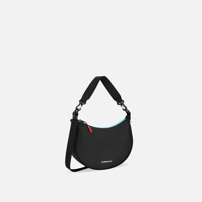 A Sherpani Mina Chromatic Black Medium Crossbody Bag, 3/4 view showing strap options on white background.  #color_chromatic-black