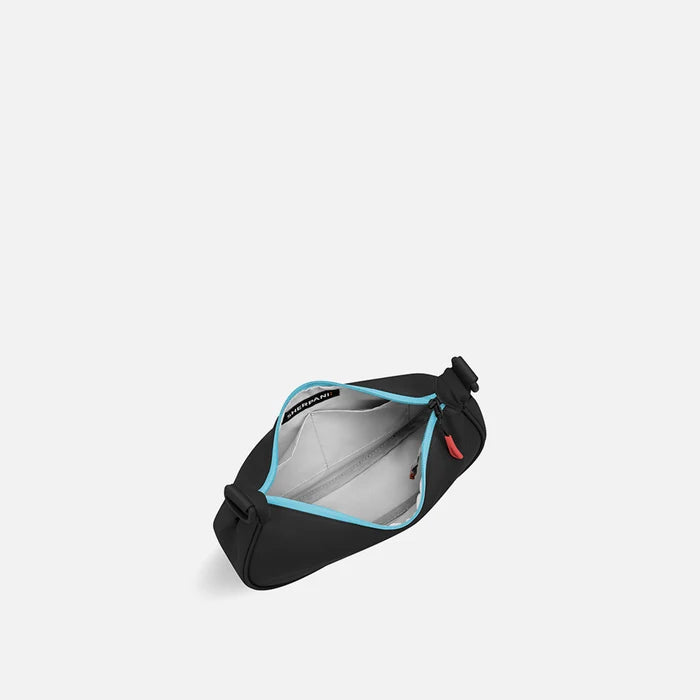 A Sherpani Mina Chromatic Black Medium Crossbody Bag, above view showing inside main pocket on white background.   #color_chromatic-black