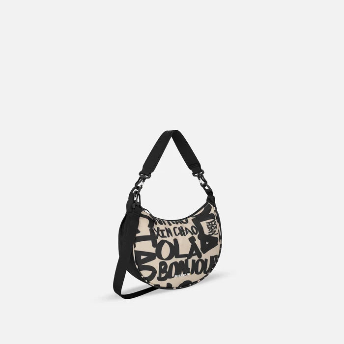 A Sherpani Mina Ciao Medium Crossbody Bag, 3/4 view showing strap options on white background.  #color_ciao-print
