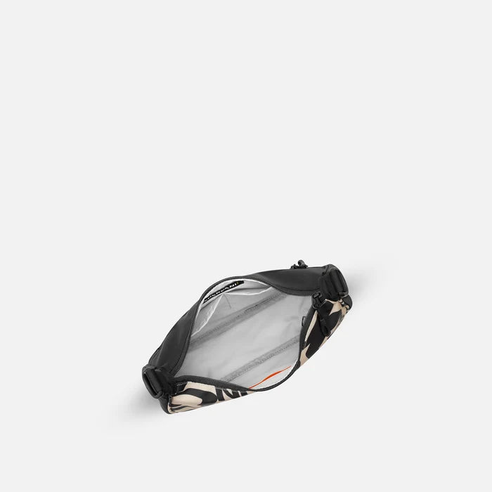A Sherpani Mina Ciao Medium Crossbody Bag, above view showing inside main pocket on white background.   #color_ciao-print