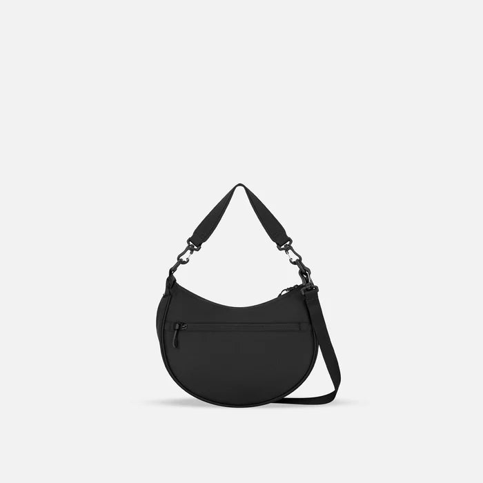 A Sherpani Mina Ciao Black Medium Crossbody Bag, back view showing straps and lockable pocket on white background.  #color_ciao-print