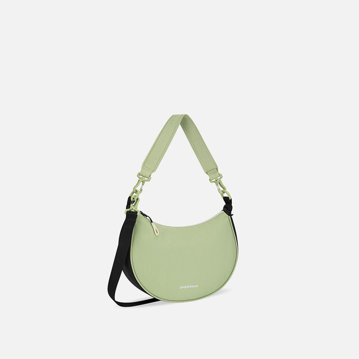 A Sherpani Mina Palm Green Medium Crossbody Bag, 3/4 view showing strap options on white background.  #color_palm-green