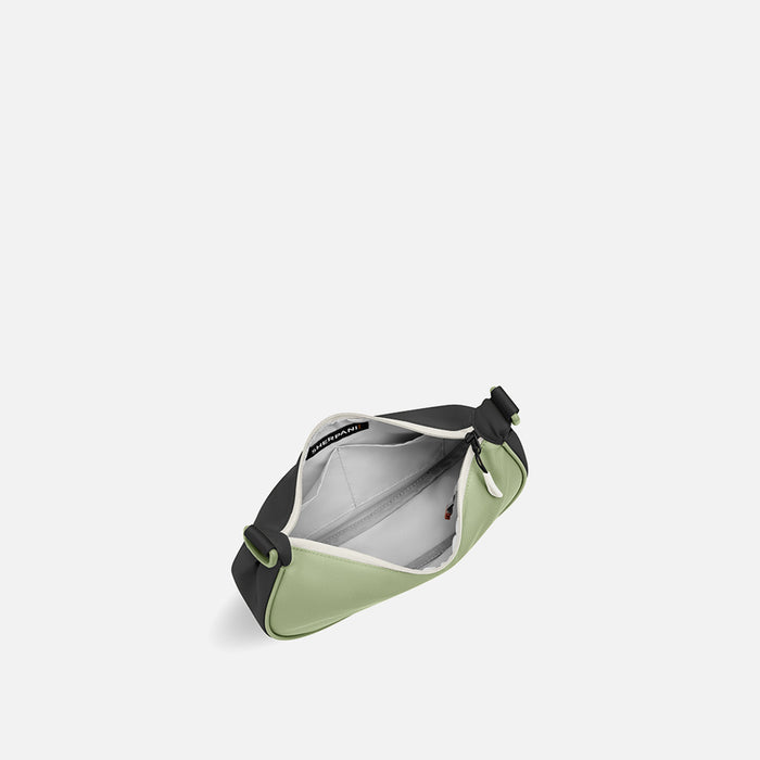A Sherpani Mina Palm Green Medium Crossbody Bag, above view showing inside main pocket on white background.  #color_palm-green