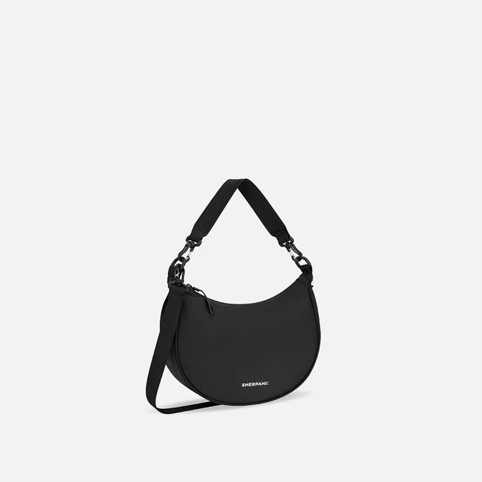 A Sherpani Mina Raven Black Medium Crossbody Bag, 3/4 view showing strap options on white background.  #color_raven-black